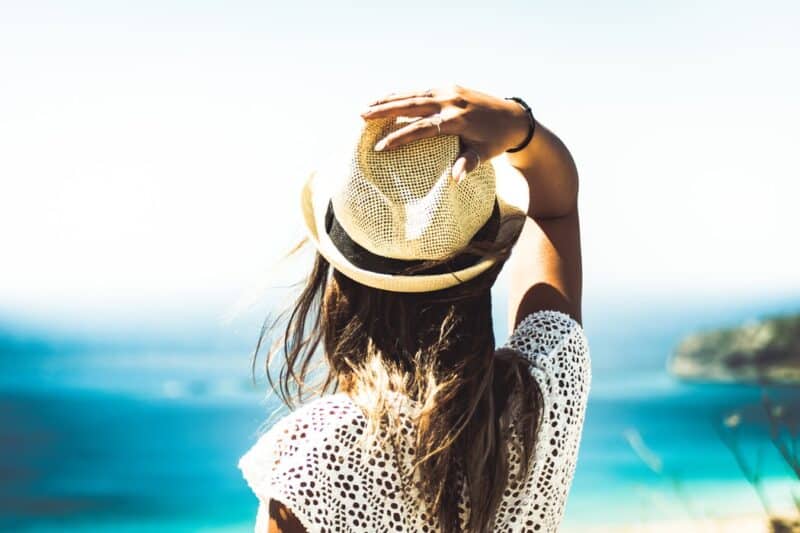 Woman holding a hat