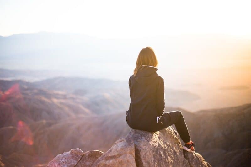 Woman looking out on mountain