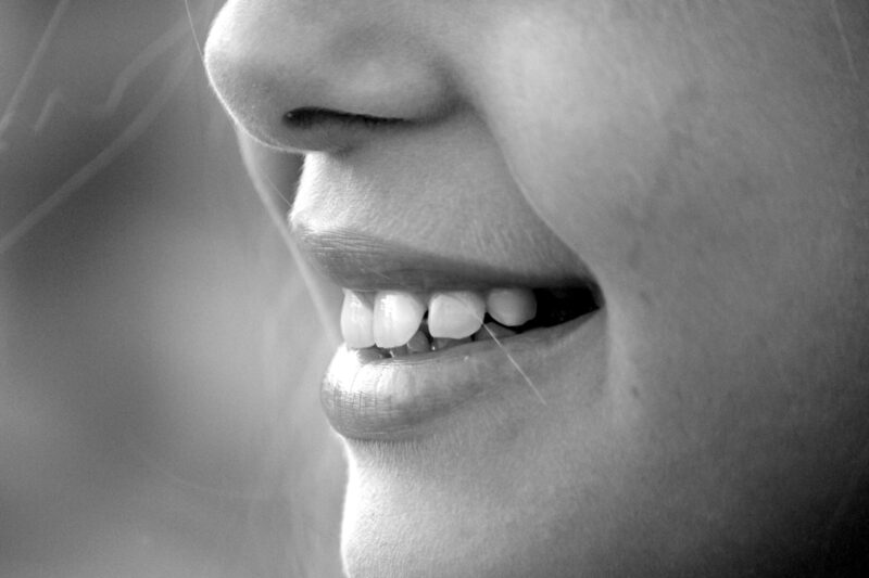 Black and white picture of a child smiling