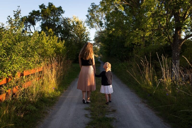 Mother and daughter on a road