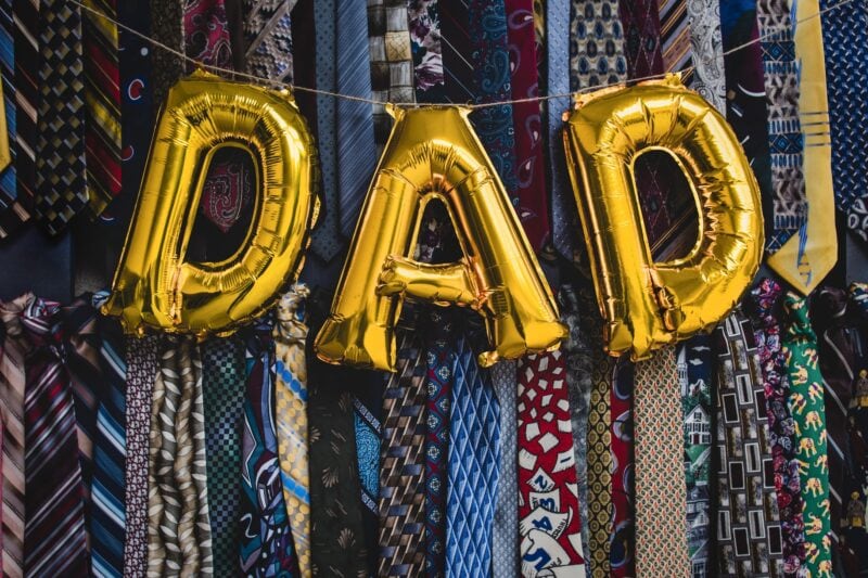 Dad balloons in front of ties