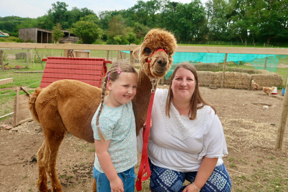 Bumblebarn me and Erin with an alpaca