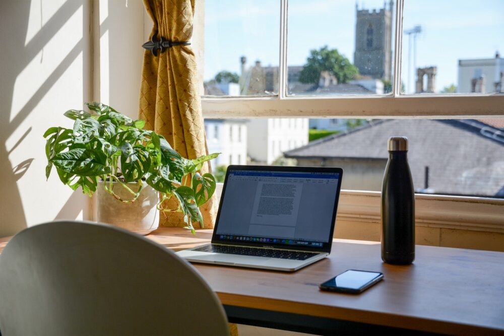 MacBook pro on brown wooden table