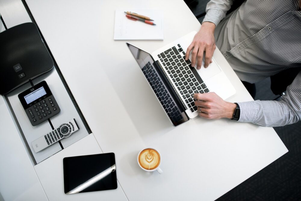 Man working at laptop at a desk