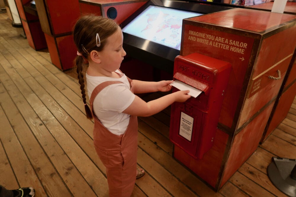 Erin posting a letter on the Cutty Sark