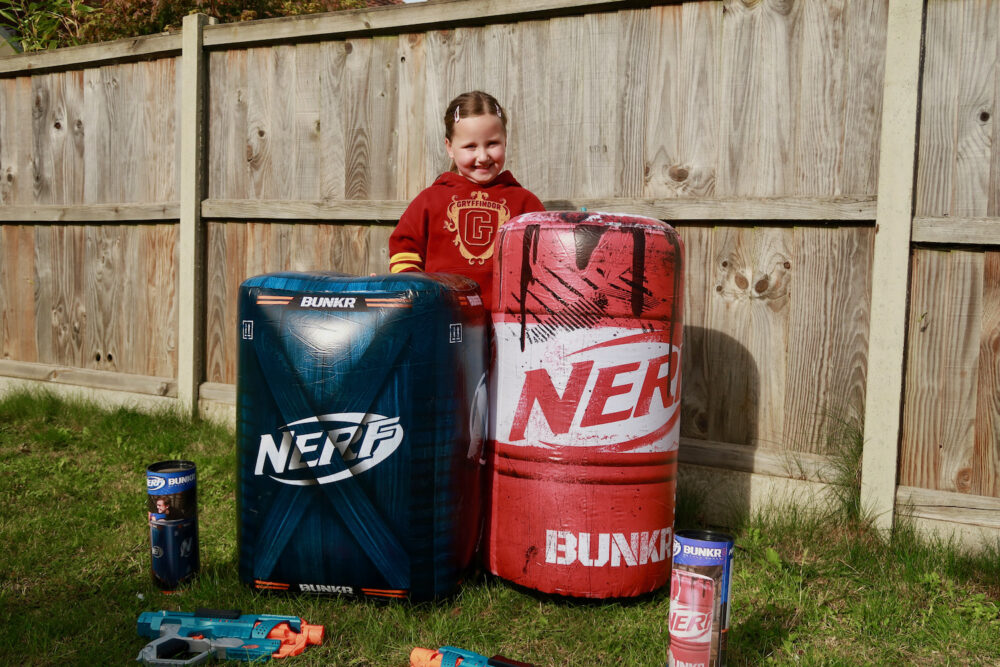 Erin wtih the Nerf BUNKR Toxic Barrel and Caution Crate