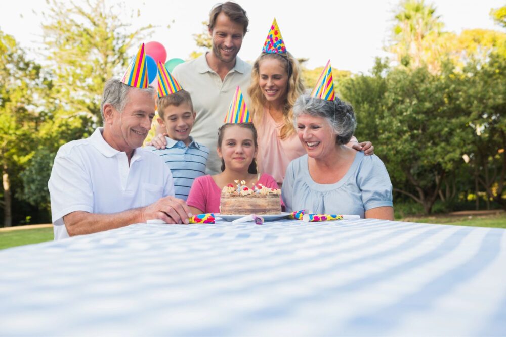 Happy extended family celebrating little girls birthday