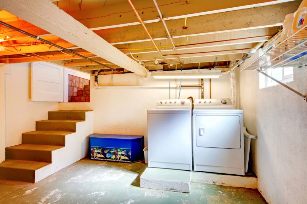 Basement laundry room with old appliances