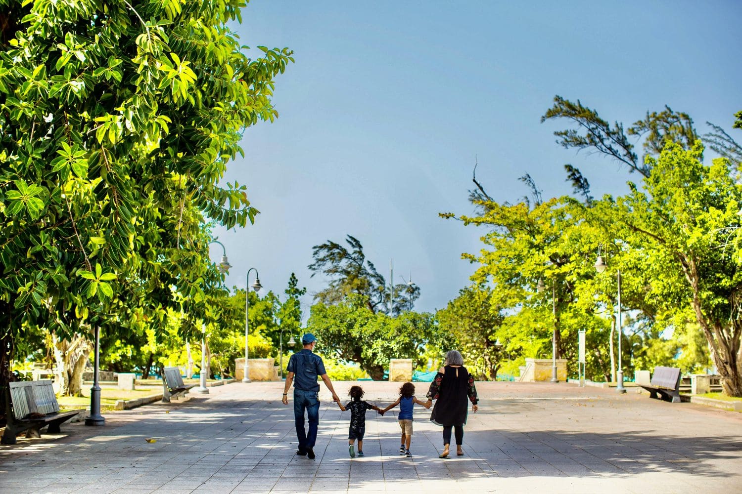 Family walking down a large path on holiday