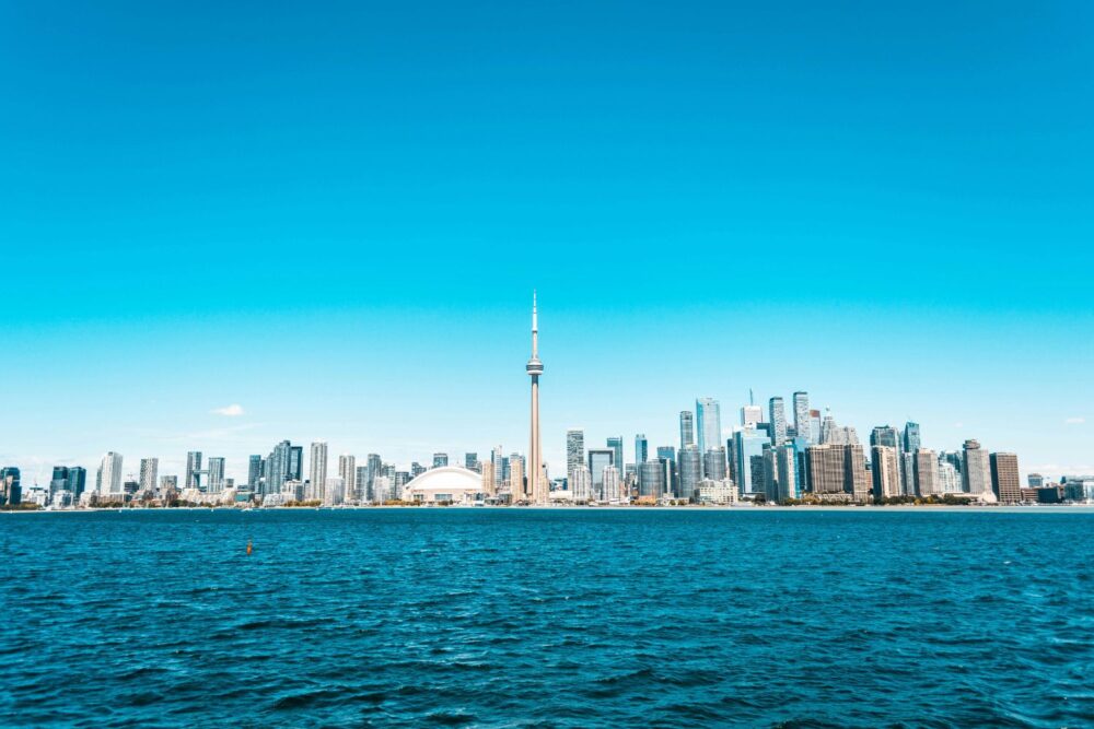 Toronto skyline under a blue sky