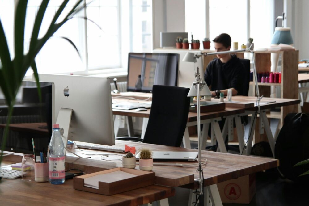 Man Sitting in Front of Computer in an office setting