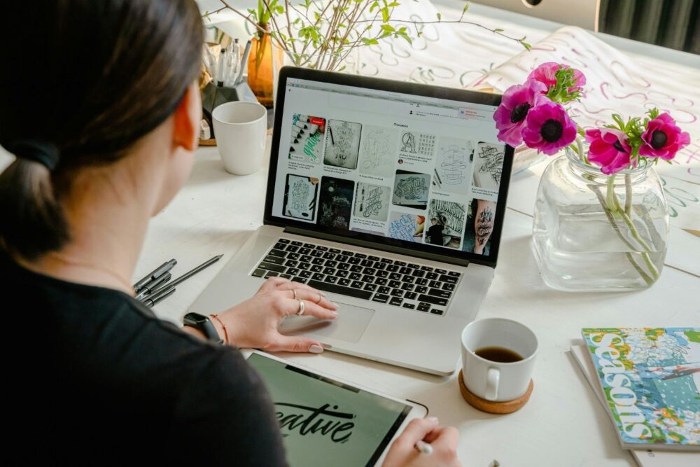 Photo Of Person Using Laptop For Graphic Designs