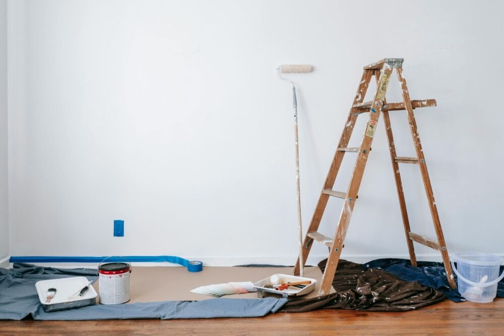 Brown Wooden Ladder Beside Painting Materials
