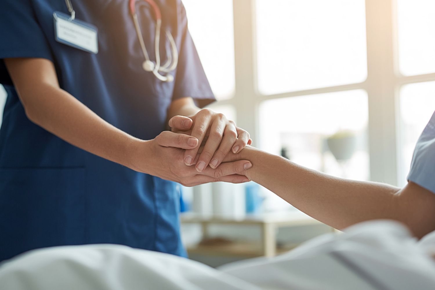 Nurse Holding Patient's Hand in Hospital