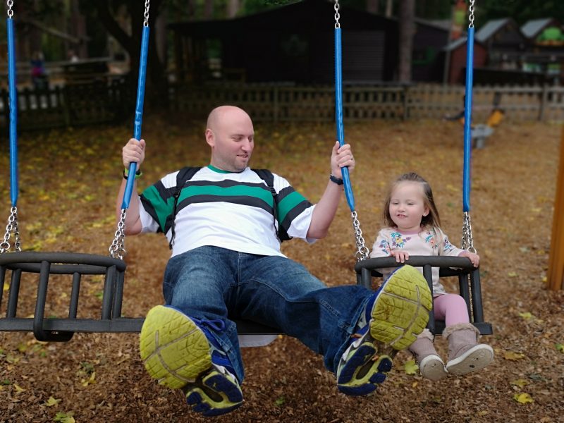 John and Erin on the swings