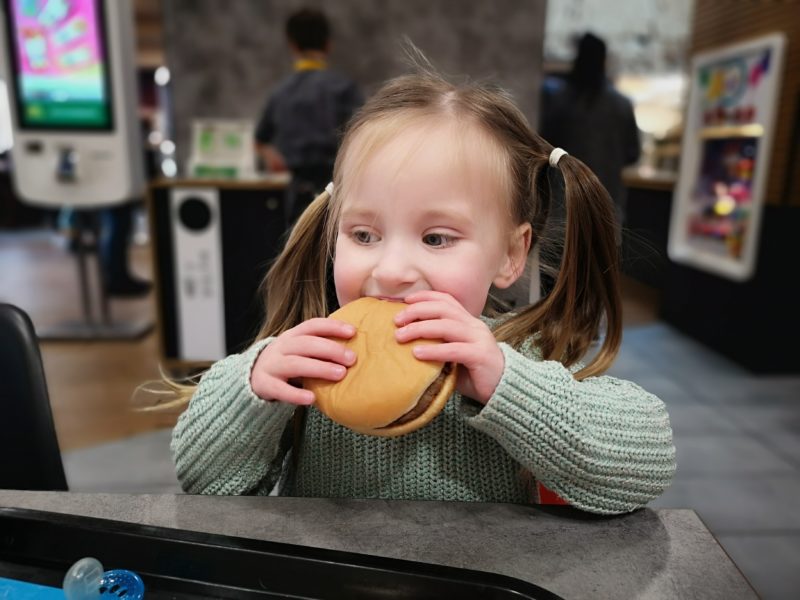 Erin eating a hamburger